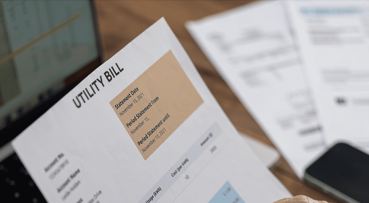An image of a utility bill represents the concept of lowering commercial energy consumption