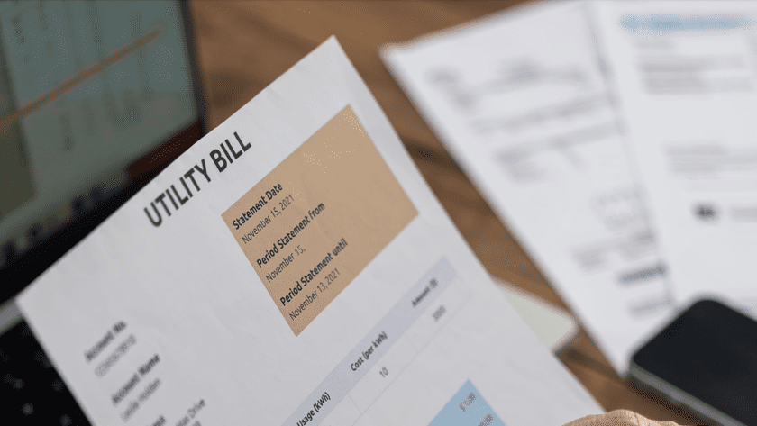 An image of a utility bill represents the concept of lowering commercial energy consumption