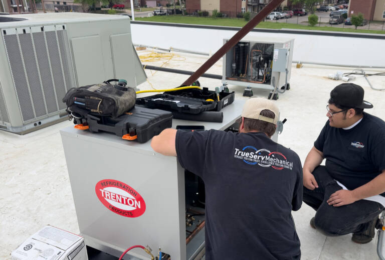 TrueServ Mechanical technicians work on a commercial refrigeration project