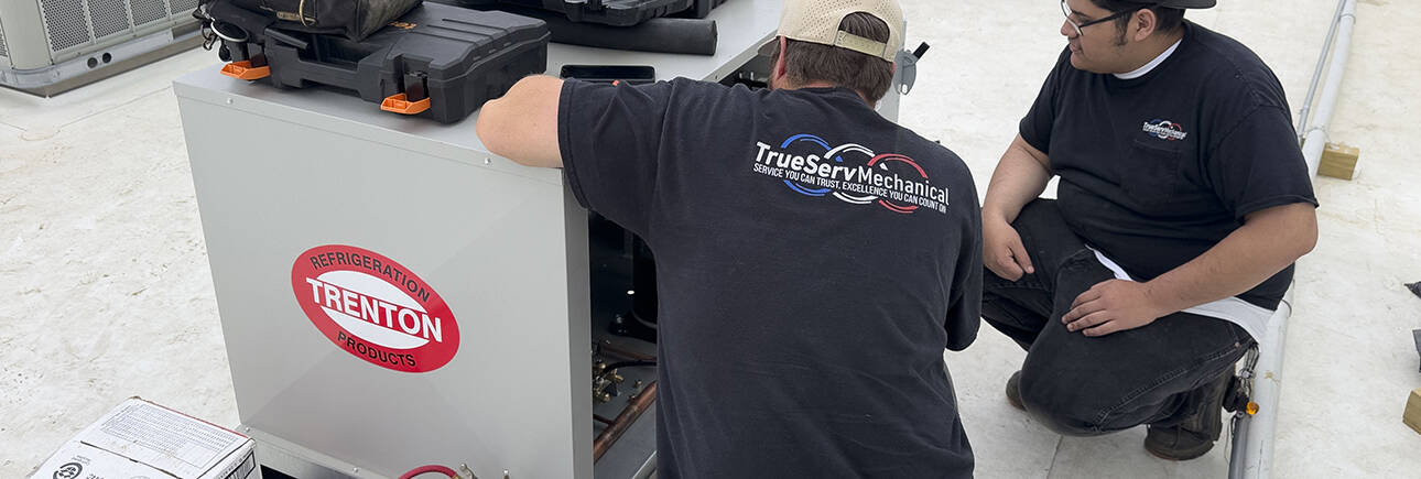 Our Team of commercial hvac experts is represented in this photo of a technician working on a unit.