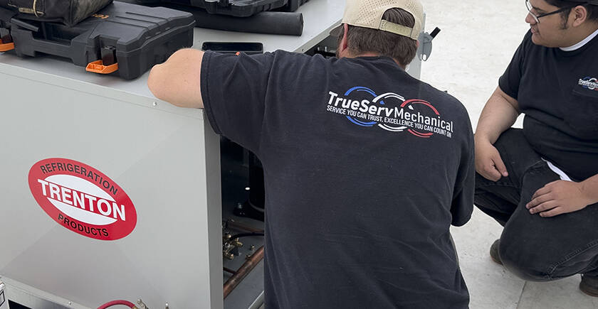 Our Team of commercial hvac experts is represented in this photo of a technician working on a unit.