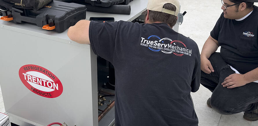 Our Team of commercial hvac experts is represented in this photo of a technician working on a unit.