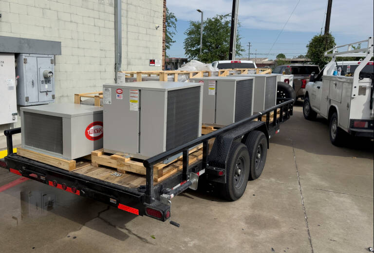 commercial refrigeration units on a trailer, ready for installation